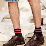 Man wearing Escuyer Men Striped Ankle Socks Off Black / Ecru with loafers — versatile smart-casual style