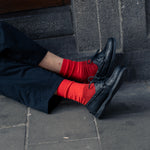 Men wearing Escuyer Purple / Blue Colour Block Socks with black shoes