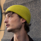 Person wearing an Escuyer ribbed merino wool beanie