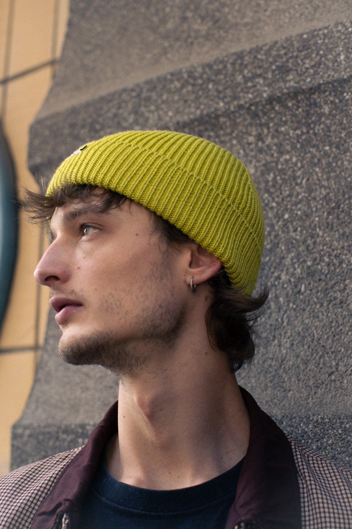 Person wearing an Escuyer ribbed merino wool beanie