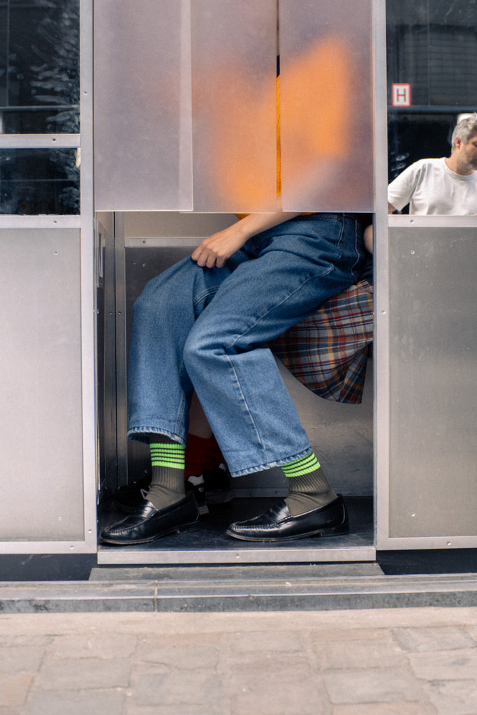 Woman wearing striped socks with loafers