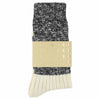A pair of melange block socks in black and ecru colors, crafted from cotton blend materials and made in Portugal