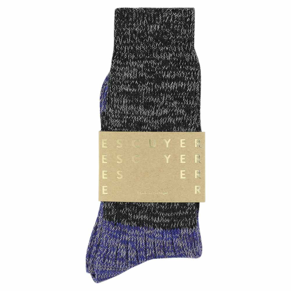 A pair of melange block socks in black and bright blue colors, crafted from cotton blend yarns and made in Portugal