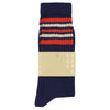 A pair of blue socks with orange and ecru stripes on the cuff.