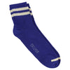 A pair of bright blue ankle socks with ecru stripes at the cuff, displaying the brand name 'Escuyer' on the side.