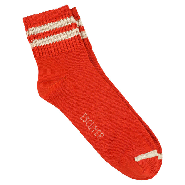 A pair of orange ankle socks with ecru stripes on the cuff and the brand name 'ESCUYER' visible on the foot area.