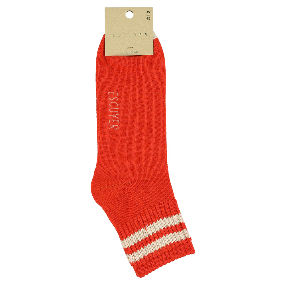 A pair of orange ankle socks with ecru stripes on the cuff and the brand name 'ESCUYER' visible on the foot area.