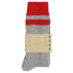 Close-up of Escuyer Grey / Red striped cashmere socks — 10% cashmere, 38% virgin wool, GRS certified recycled polyamide