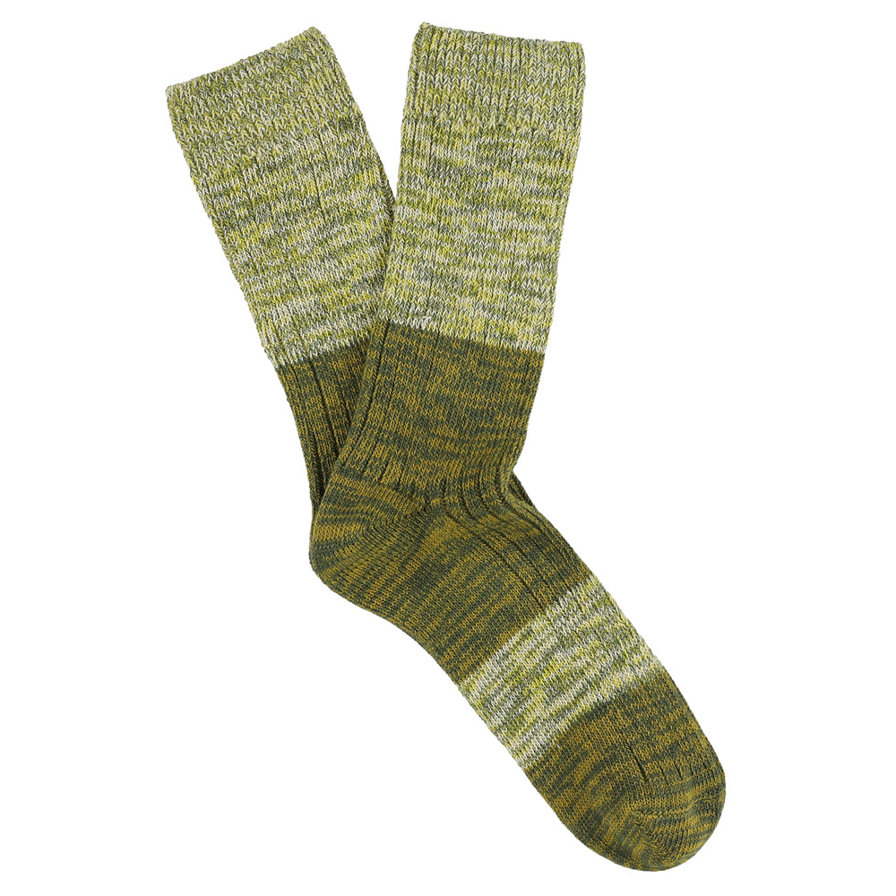 A pair of melange block socks in green colors, crafted from cotton blend yarns and made in Portugal