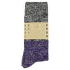 A pair of melange block socks in navy and purple colors, crafted from cotton blend yarns and made in Portugal