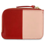 Escuyer pink and red zip wallet showing vertical colour-block split and zip closure