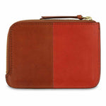 Escuyer cognac and orange zip wallet open — interior card sleeve and cash compartment