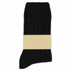 A single black cashmere crew sock with a label that has the brand name 'Escuyer' printed on it.