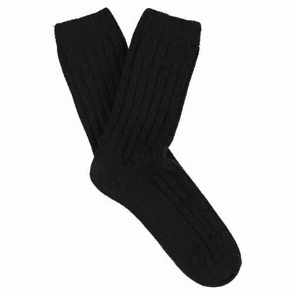 A pair of black cashmere crew socks for women, showing a ribbed texture and heel area.