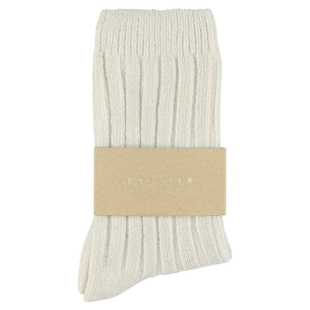 A pair of women's ecru cashmere crew socks with a brand tag attached to the ankle.