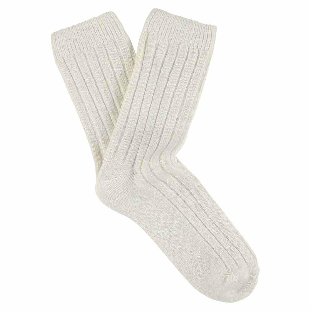 A pair of ecru-colored cashmere crew socks with a ribbed design, lying flat against a solid background.