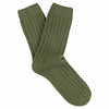 A pair of green cashmere crew socks for women displayed against a white background.