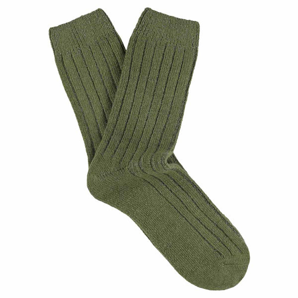 A pair of green cashmere crew socks for women displayed against a white background.