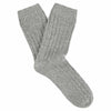 A pair of light grey cashmere crew socks for women, showing the side profile with ribbed texture.