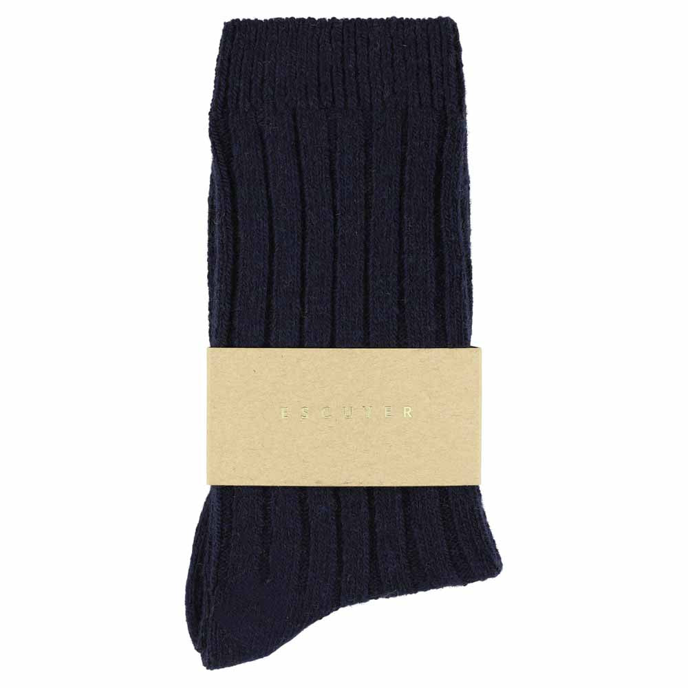 A single navy-colored cashmere crew sock with a branded tag attached to it.
