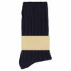 A single navy-colored cashmere crew sock with a branded tag attached to it.