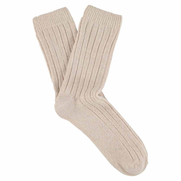 A pair of pink cashmere crew socks for women, showing a ribbed texture and ankle coverage.