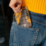 Escuyer camouflage zip wallet lifestyle — hand-dyed Italian full-grain veg-tan, made in Portugal