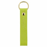 Escuyer clorofilla leather keychain — Italian vegetable tanned leather tab with gold metal ring and gold Escuyer logo