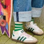 Woman wearing ecru and green striped crew socks by Escuyer, made in Portugal