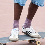 Man wearing off purple ribbed crew socks by Escuyer, made in Portugal