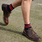 Man wearing Escuyer Men Striped Ankle Socks Bright Blue / Ecru with brown loafers — bold summer style