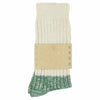 A pair of melange block socks in ecru and green colors, crafted from cotton blend yarns and made in Portugal