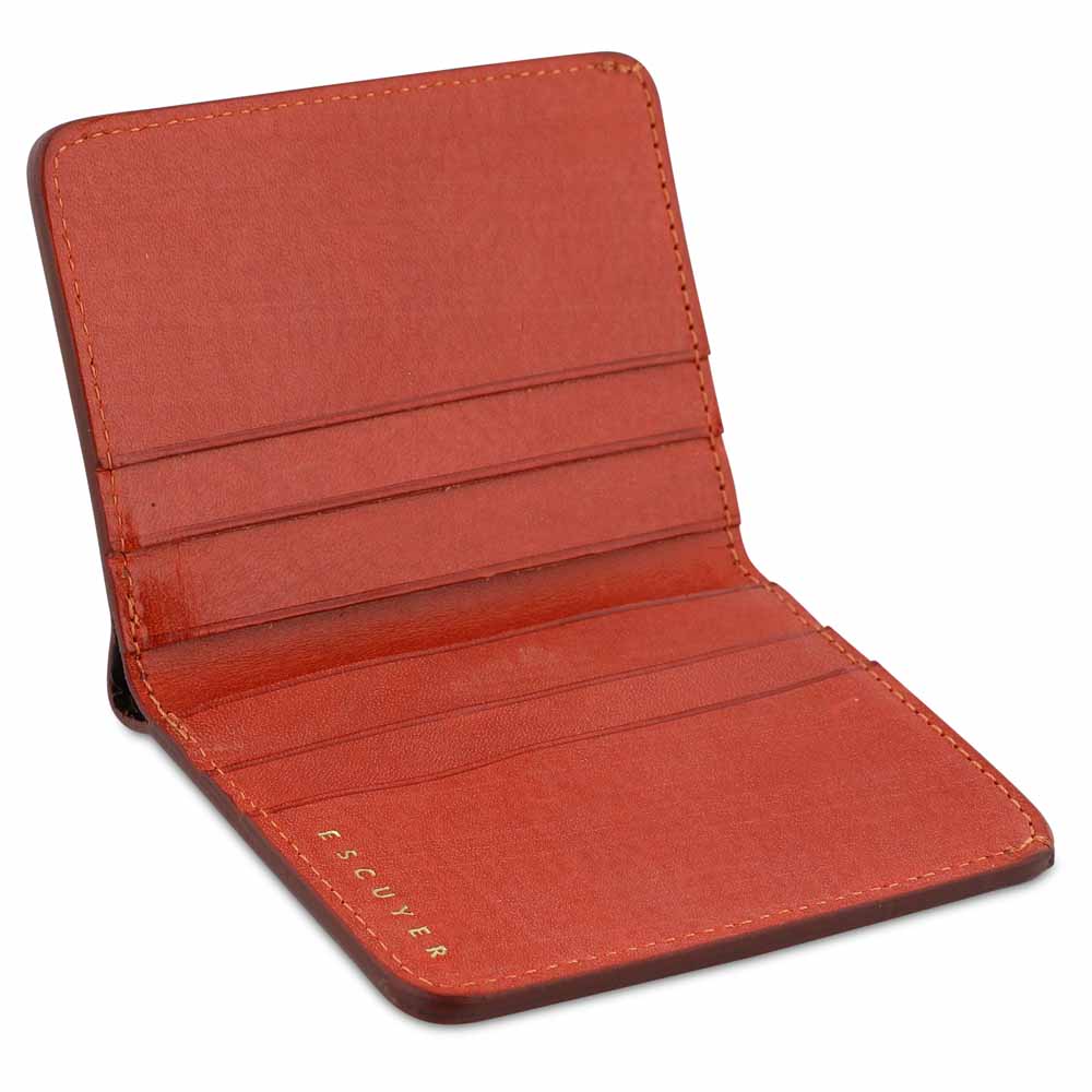 Escuyer orange slim wallet showing slim profile and hand painted edges