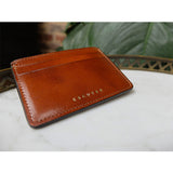 Cognac leather card wallet by Escuyer, made in Portugal, showing natural leather texture